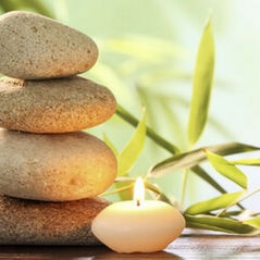 stacked rocks and candle